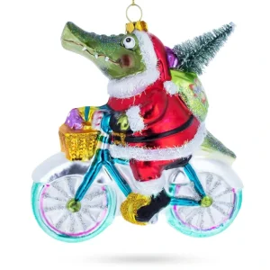 Playful Alligator Riding Bicycle With Gifts - Blown Glass Christmas Ornament - CaringForTots - Professional Baby and Children's Products | Caring for Growth, Caring for Every Moment* Christmas Tree Ornaments